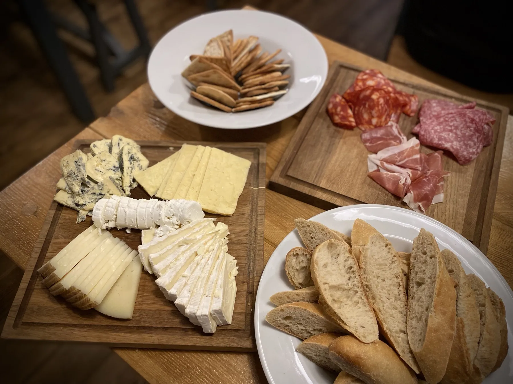 Cheese and charcuterie boards with fresh bread